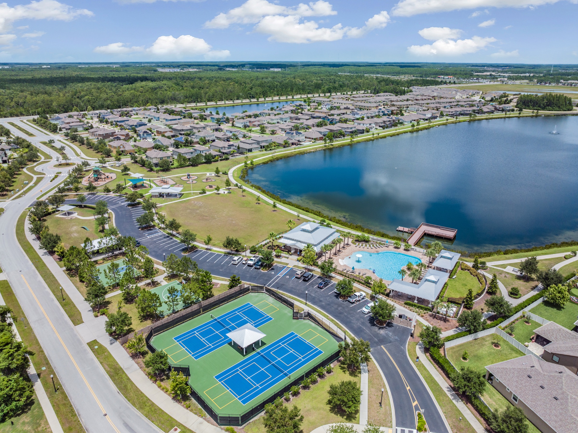 Aerial view of Long Lake Ranch lake, pool and courts
